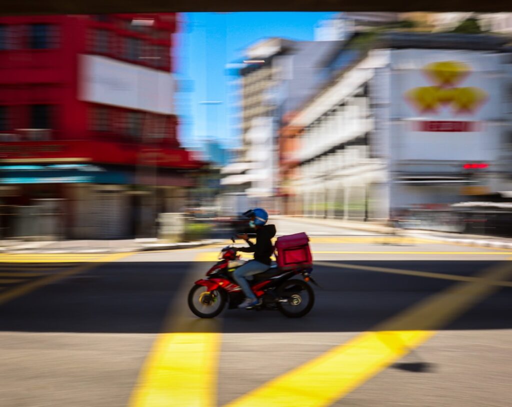 delivery driver on a motorcycle